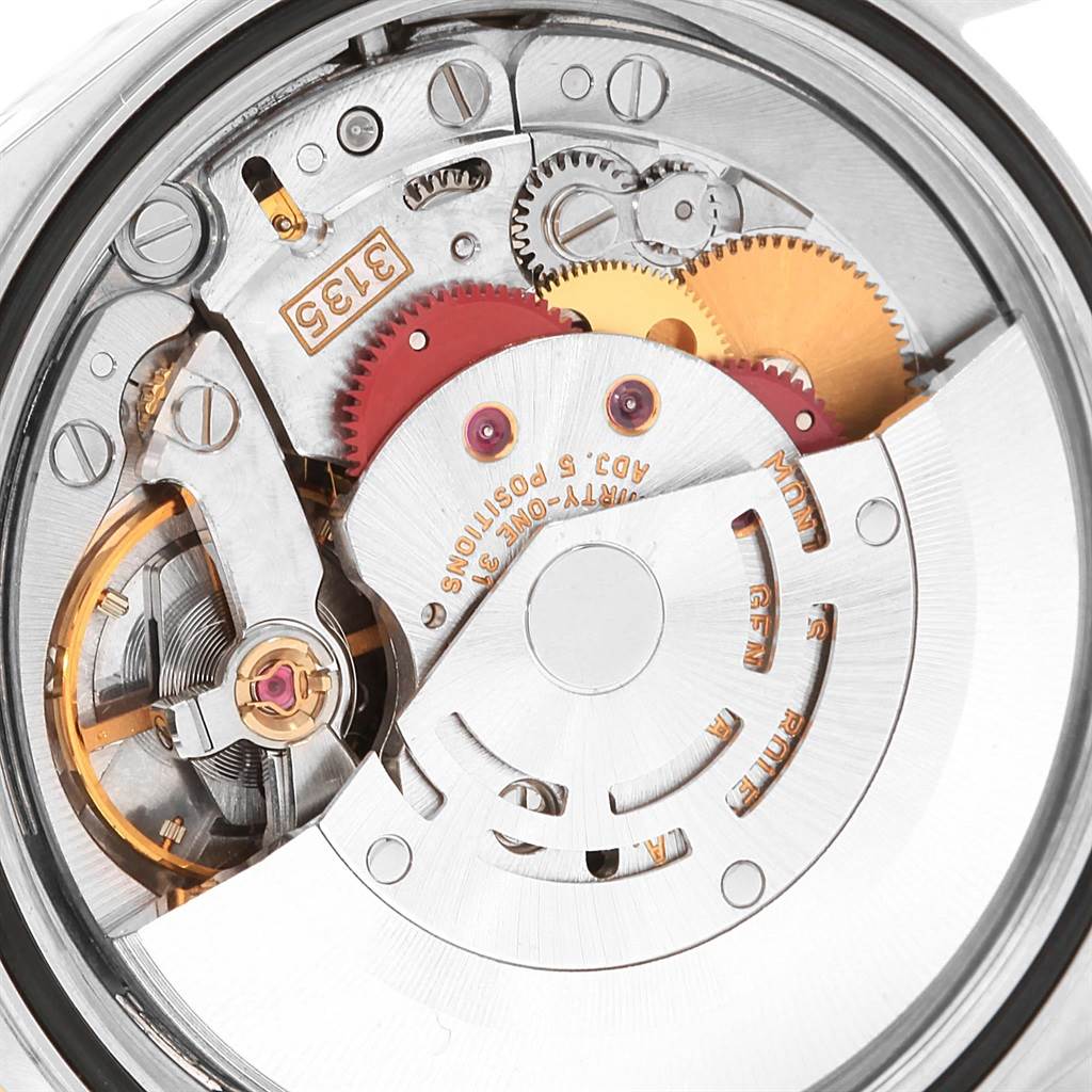 This is a close-up view of the movement and inner mechanisms of a Rolex Datejust 16233 Men's Steel and Gold (two tone) Blue Dial 16233 Men's Steel and Gold (two tone) Blue Dial watch.