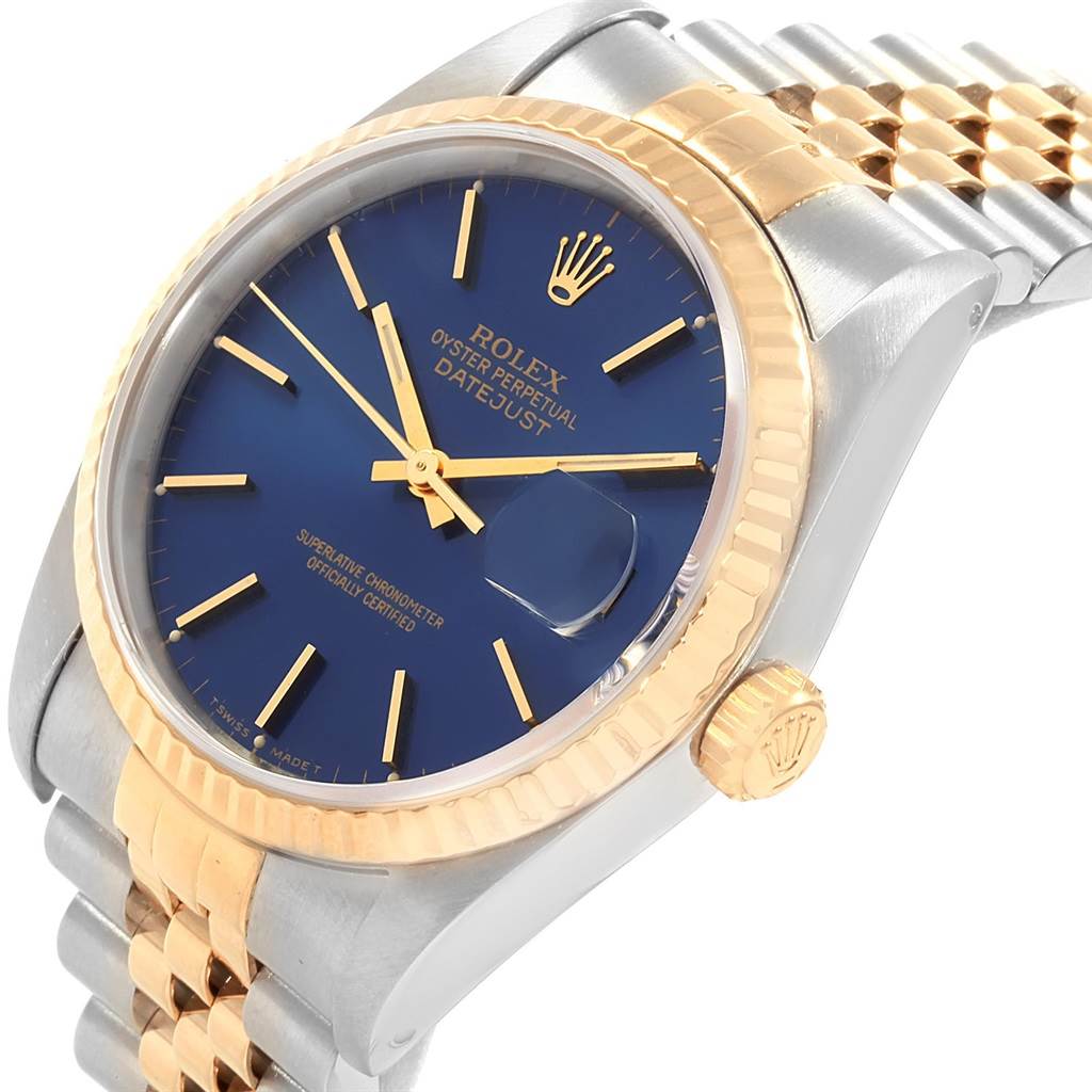 This image shows a Rolex Datejust 16233 Men's Steel and Gold (two tone) Blue Dial 16233 Men's Steel and Gold (two tone) Blue Dial watch at a slight angle, highlighting its blue dial, gold bezel, and Jubilee bracelet.