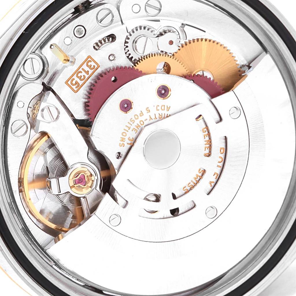This close-up image shows the intricate movement and internal mechanics of a Rolex Datejust 16233 Men's Steel and Gold (two tone) Champagne Dial 16233 Men's Steel and Gold (two tone) Champagne Dial model.