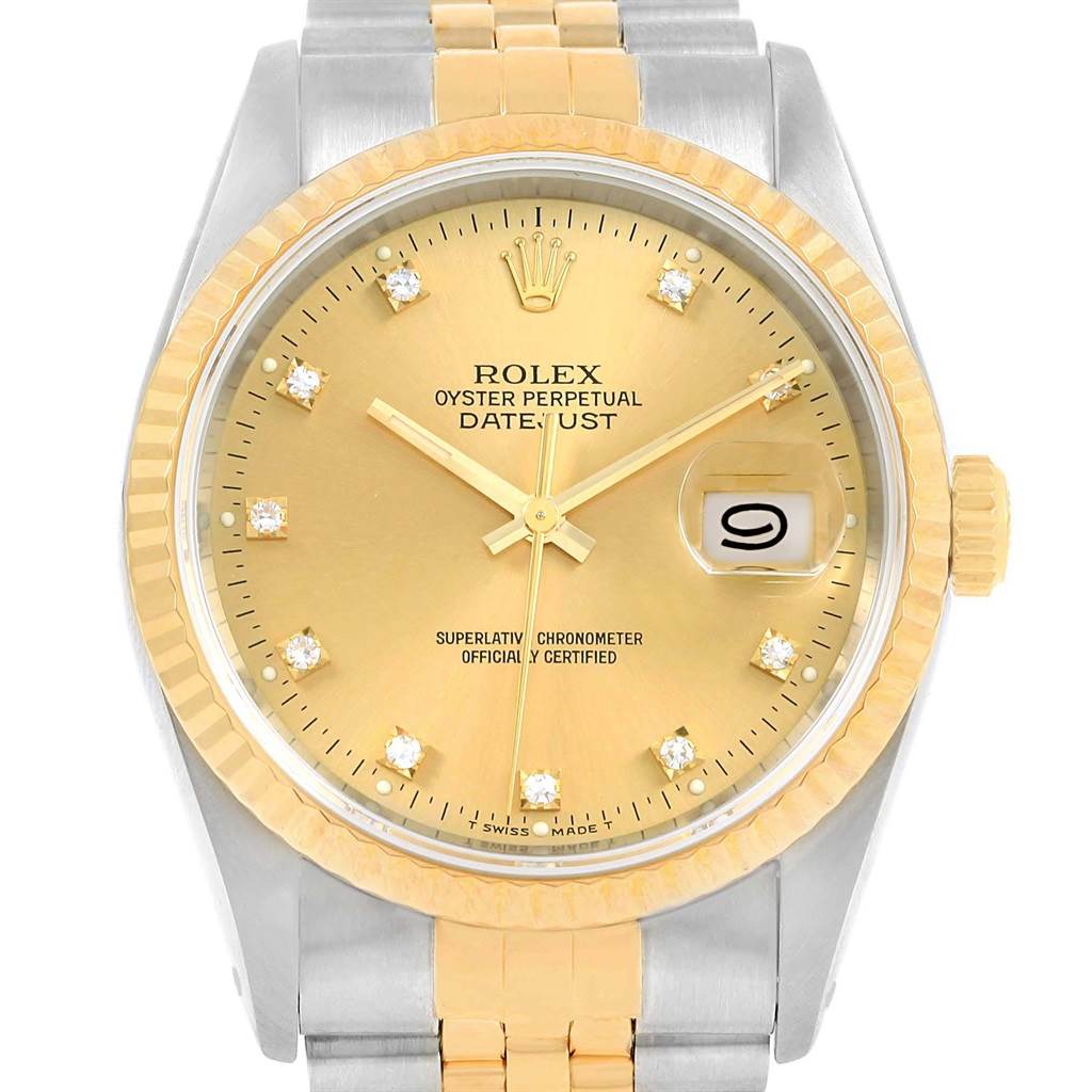 This image shows the face, bezel, and part of the bracelet of a Rolex Datejust 16233 Men's Steel and Gold (two tone) Champagne Dial 16233 Men's Steel and Gold (two tone) Champagne Dial watch in a front-facing angle.