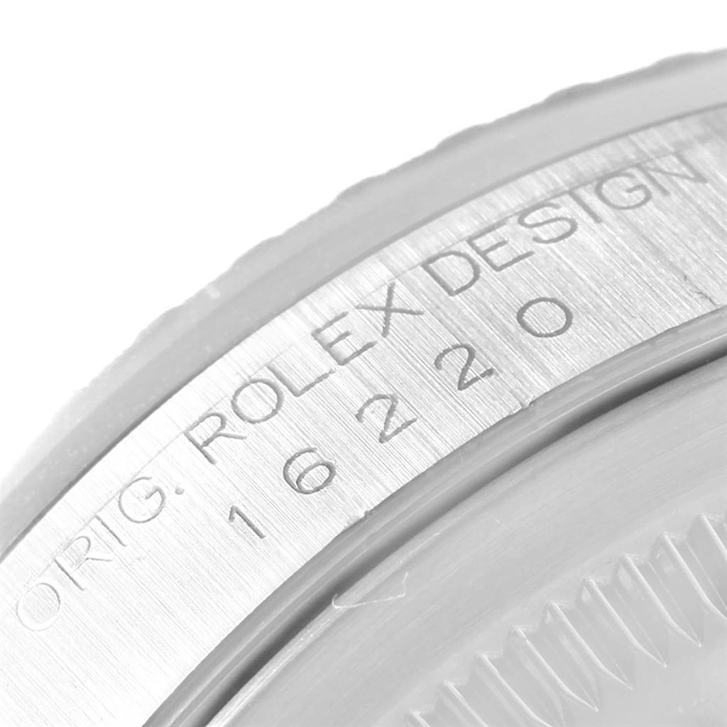 The image shows a close-up of the engraved bezel on a Rolex Datejust 16220 Men's Stainless Steel Silver Dial 16220 Men's Stainless Steel Silver Dial watch, displaying "ORIG. ROLEX DESIGN 16220".