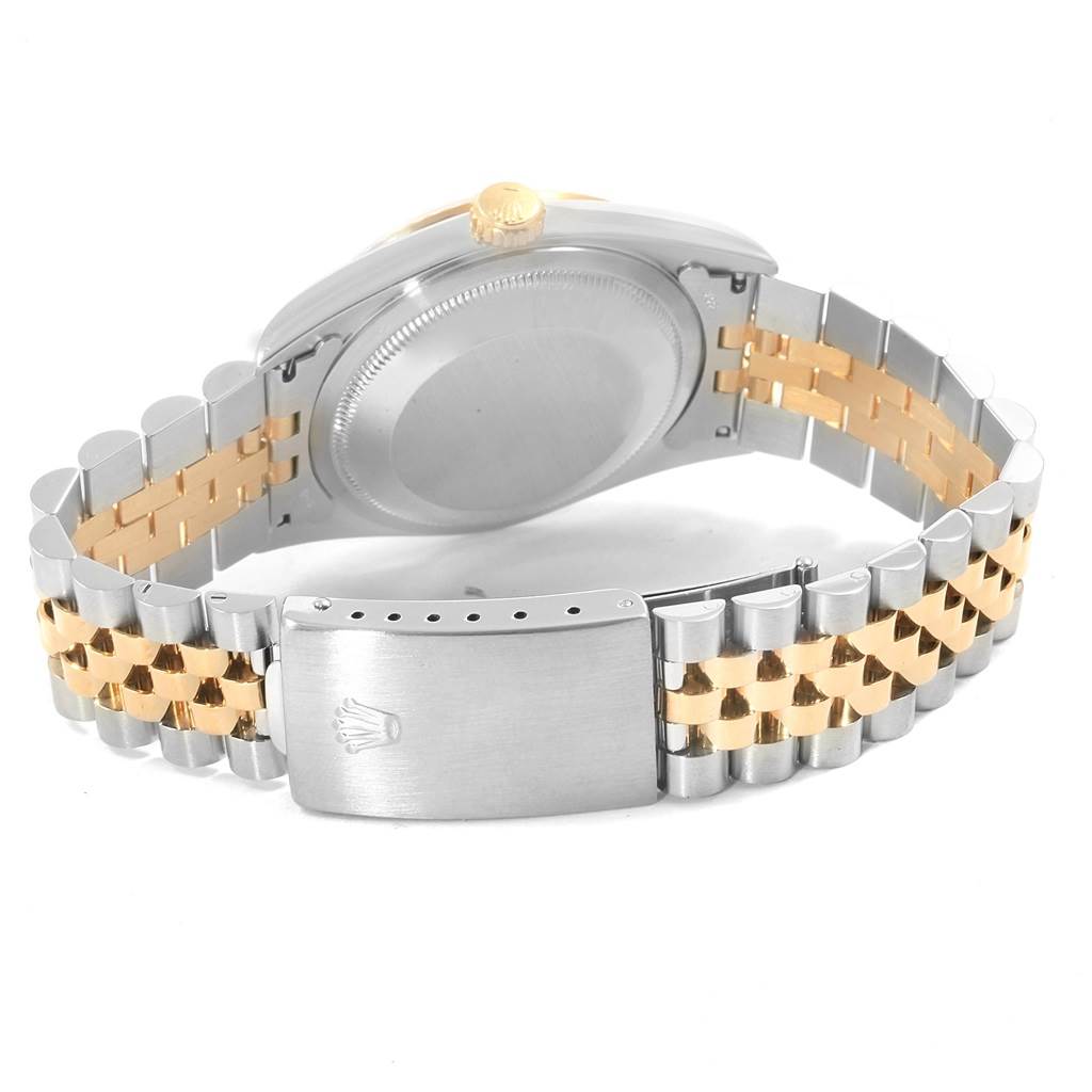 This image shows the back of a Rolex Datejust 16233 Men's Steel and Gold (two tone) Champagne Dial 16233 Men's Steel and Gold (two tone) Champagne Dial watch, highlighting its clasp and Jubilee bracelet in two-tone metal.