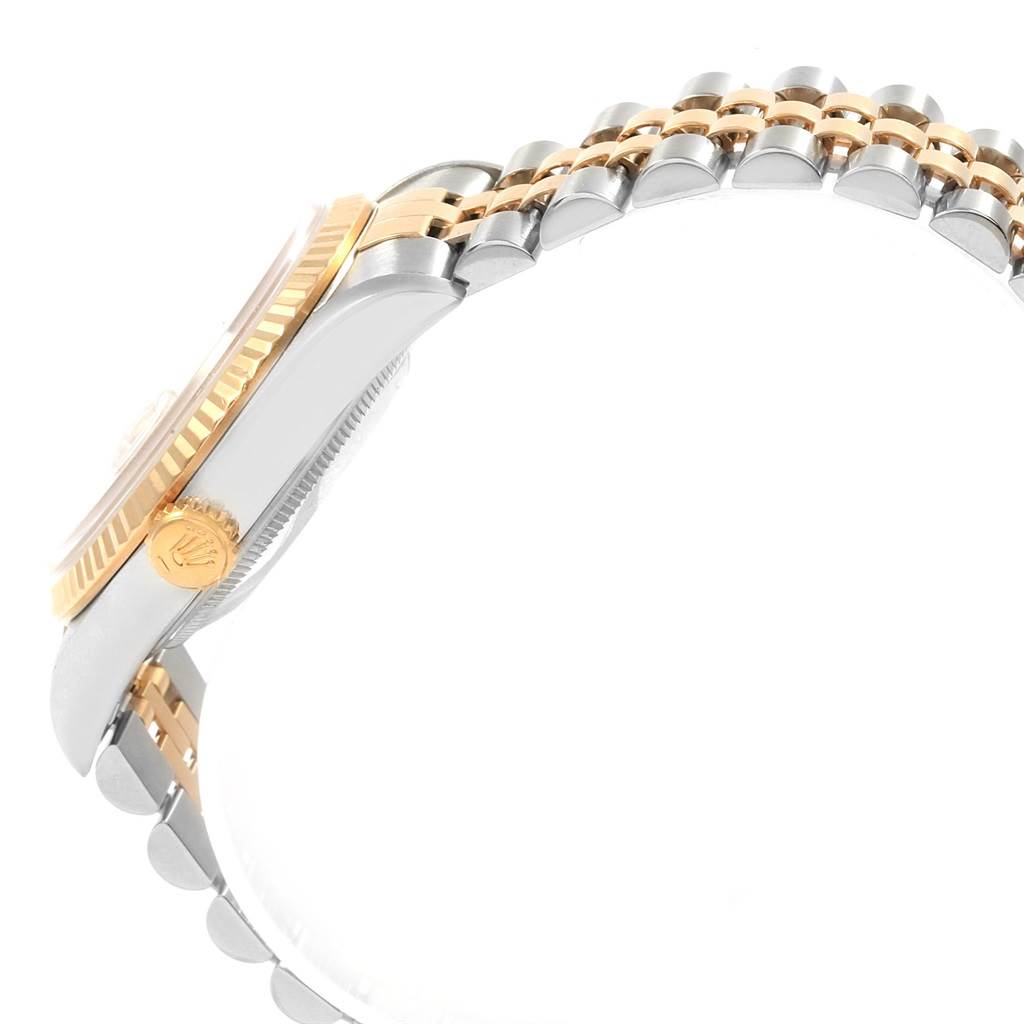 This image shows a side angle of a Rolex Datejust 16233 Men's Steel and Gold (two tone) Champagne Dial 16233 Men's Steel and Gold (two tone) Champagne Dial highlighting the crown, bezel, and part of the bracelet.