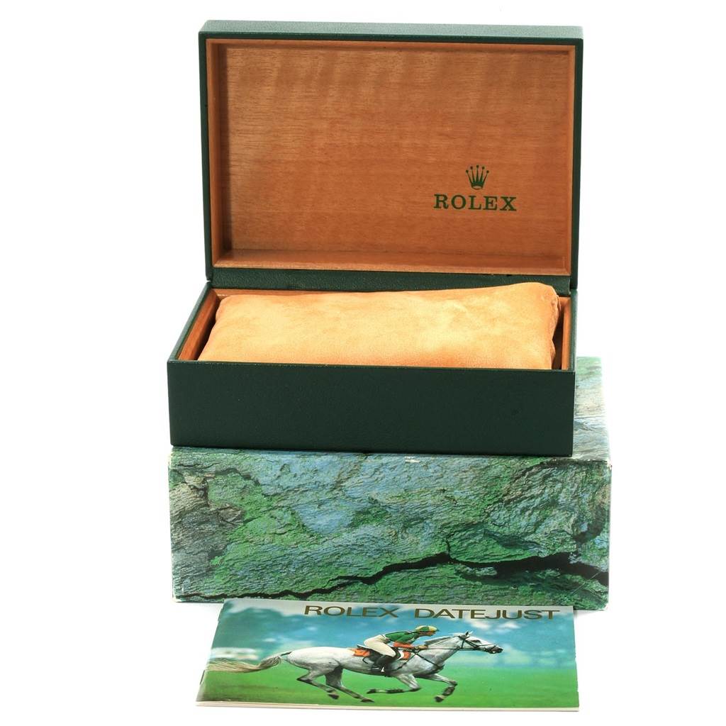 The image shows the box, pillow, and booklet of a Rolex Datejust 16233 Men's Steel and Gold (two tone) Champagne Dial 16233 Men's Steel and Gold (two tone) Champagne Dial watch.