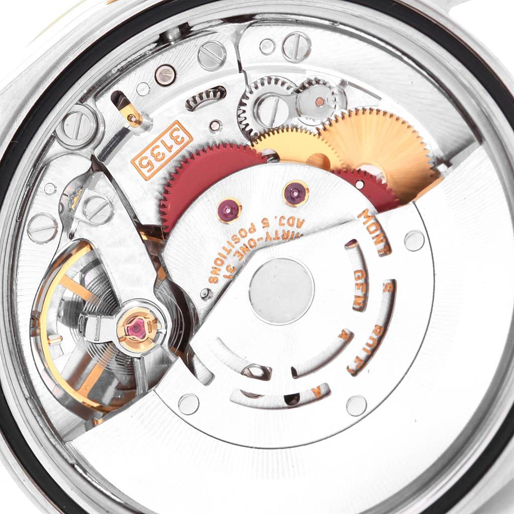 The image shows a close-up view of the Rolex Datejust 16233 Men's Steel and Gold (two tone) Champagne Dial 16233 Men's Steel and Gold (two tone) Champagne Dial movement mechanism, highlighting gears and internal components.