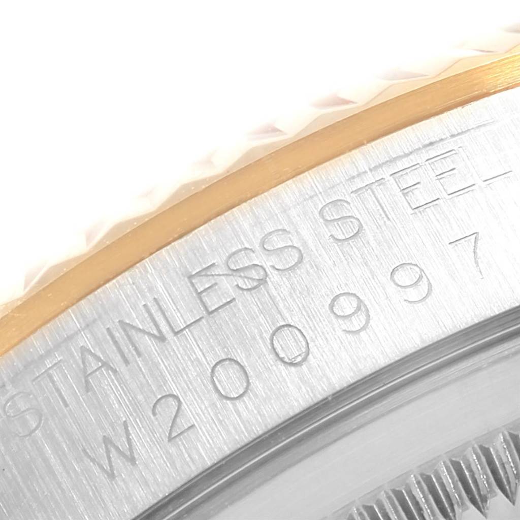 This image shows a close-up angle of the case back of a Rolex Datejust 16233 Men's Steel and Gold (two tone) Champagne Dial 16233 Men's Steel and Gold (two tone) Champagne Dial, highlighting the serial number and material inscription.