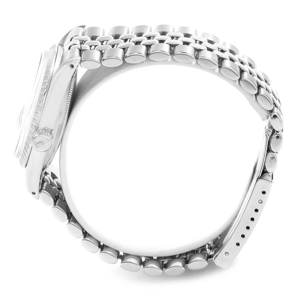 This side view of the Rolex Datejust 16030 Men's Stainless Steel White Dial 16030 Men's Stainless Steel White Dial watch focuses on the case, bracelet, and clasp.