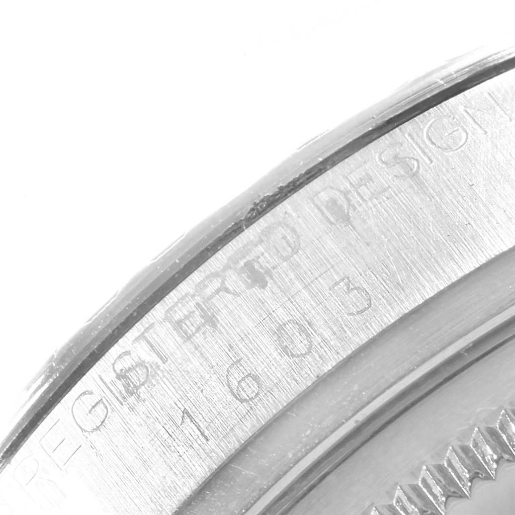 The image shows a close-up of the side case and part of the serial engraving of a Rolex Datejust 16030 Men's Stainless Steel White Dial 16030 Men's Stainless Steel White Dial watch.