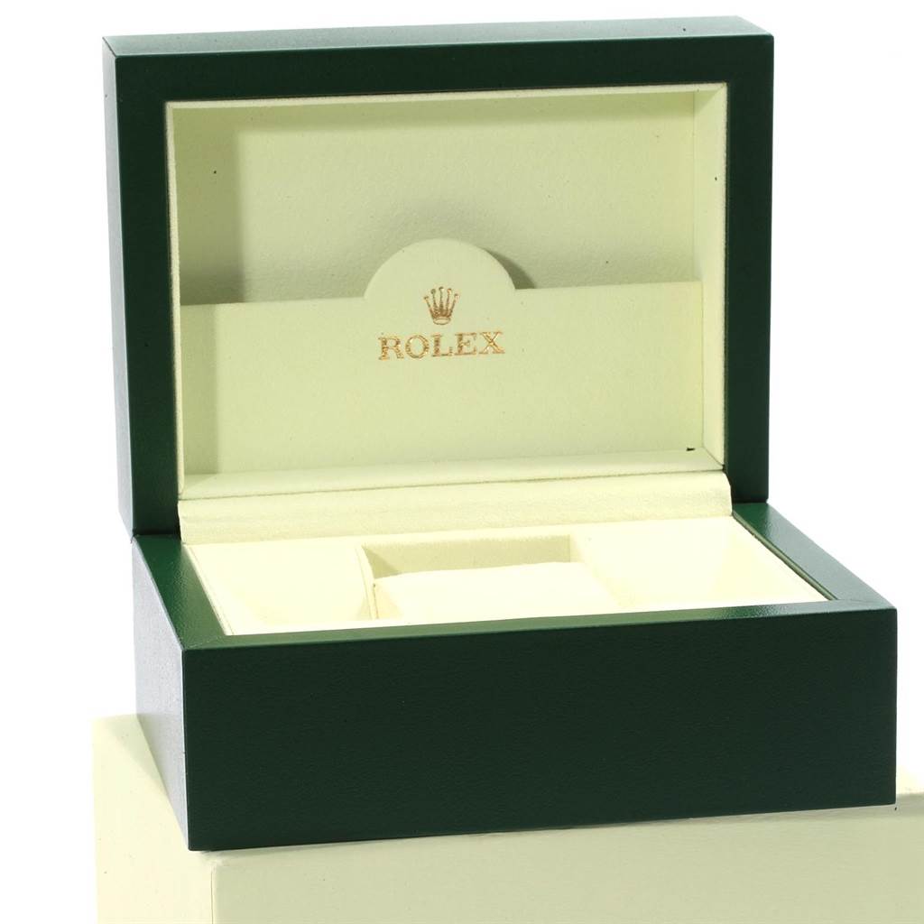 The image shows an open Rolex Datejust 116200 Men's Stainless Steel White Dial 116200 Men's Stainless Steel White Dial watch box with a green exterior and a cream interior.