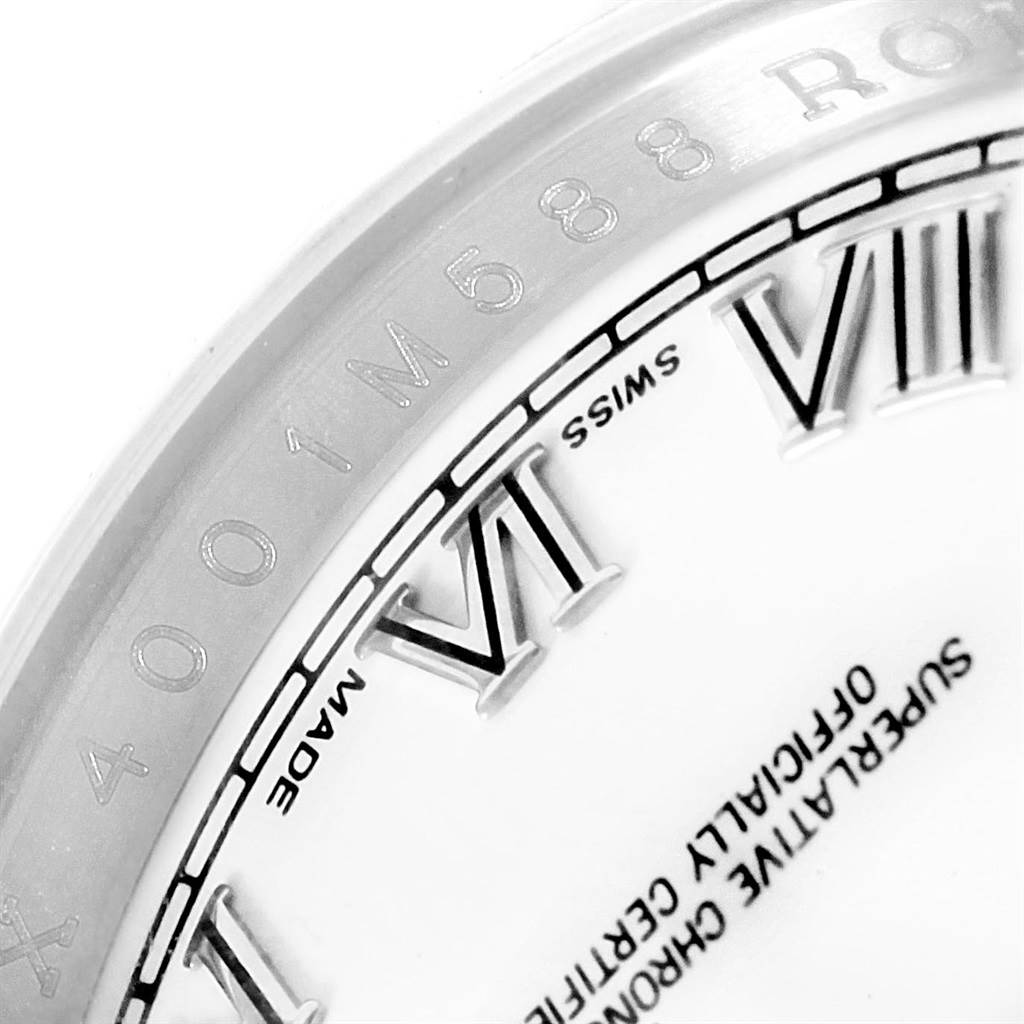 This image shows a close-up of the dial and bezel inscriptions of a Rolex Datejust 116200 Men's Stainless Steel White Dial 116200 Men's Stainless Steel White Dial watch.