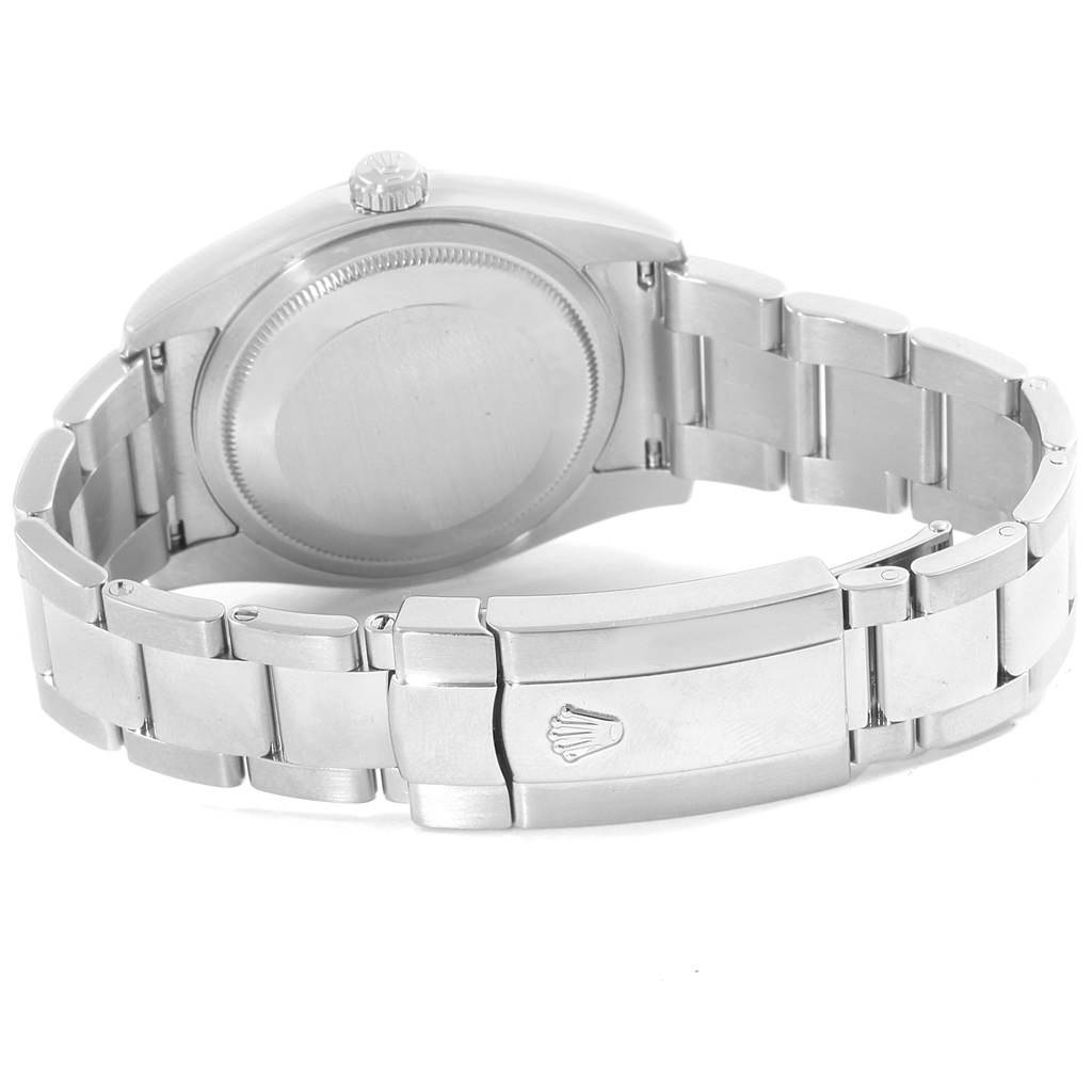 The image shows the back view of a Rolex Datejust 116200 Men's Stainless Steel White Dial 116200 Men's Stainless Steel White Dial watch, including the watch case, crown, and metal bracelet with the clasp.