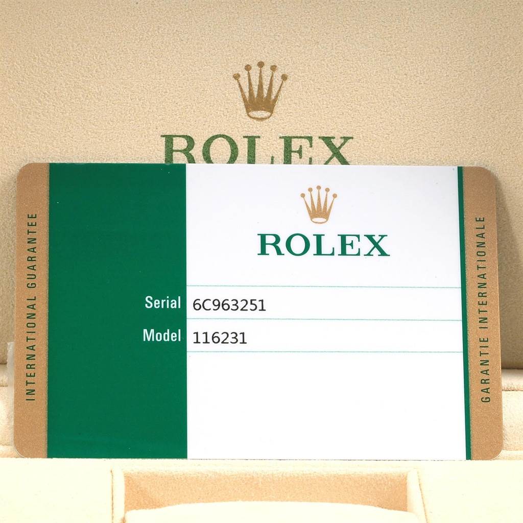 The image shows the international guarantee card for a Rolex Datejust 116231 Men's Steel and Gold (two tone) Black Dial 116231 Men's Steel and Gold (two tone) Black Dial model watch with a visible serial number and model number.