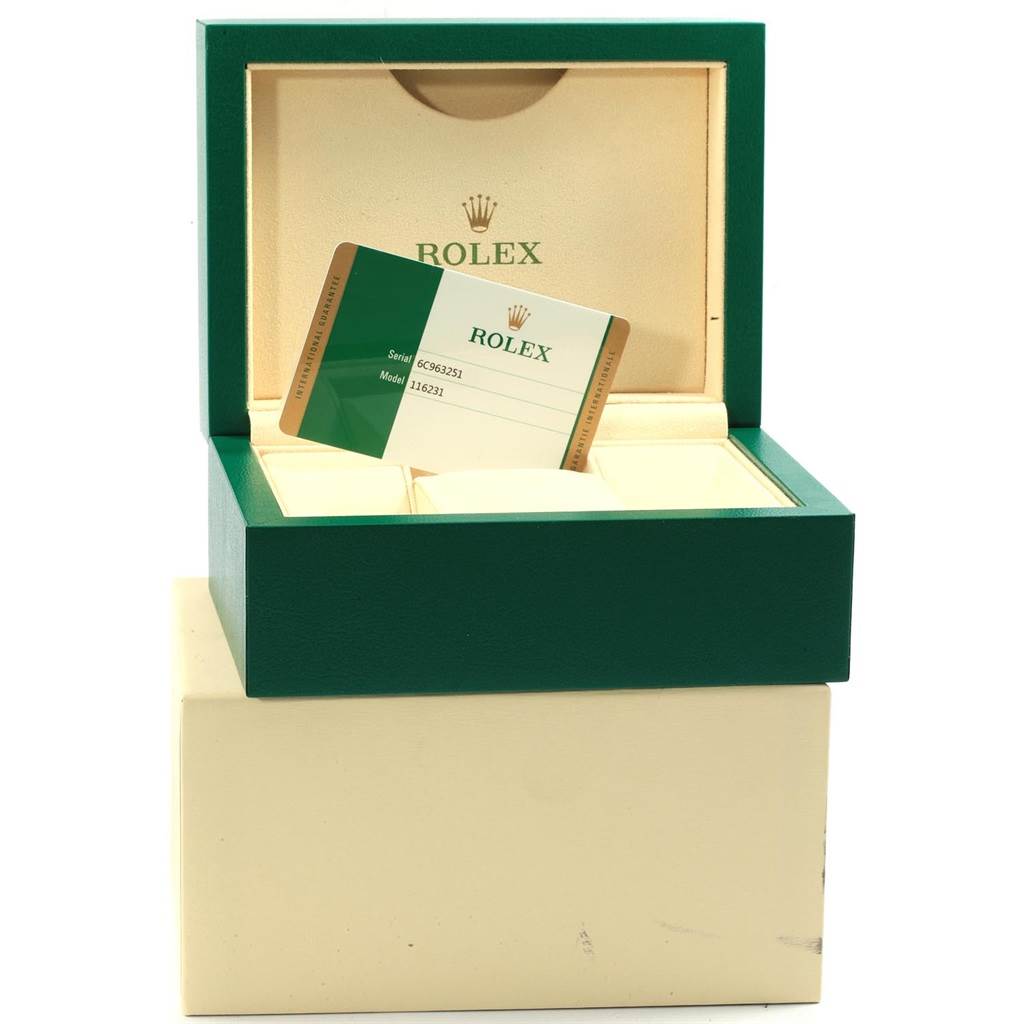 The image shows the open box and warranty card of a Rolex Datejust 116231 Men's Steel and Gold (two tone) Black Dial 116231 Men's Steel and Gold (two tone) Black Dial watch.