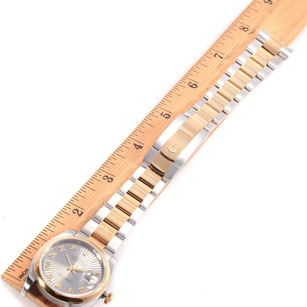 The image shows a top-down view of a Rolex Datejust 116203 Men's Stainless Steel Grey Dial 116203 Men's Stainless Steel Grey Dial watch, including its face, dial, and two-tone metal bracelet, next to a ruler.