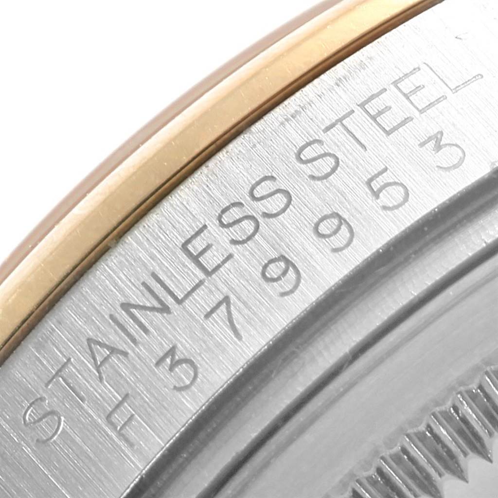 This close-up image shows a partial view of the bezel and case of a Rolex Datejust 116203 Men's Stainless Steel Grey Dial 116203 Men's Stainless Steel Grey Dial watch, highlighting the "Stainless Steel" text.