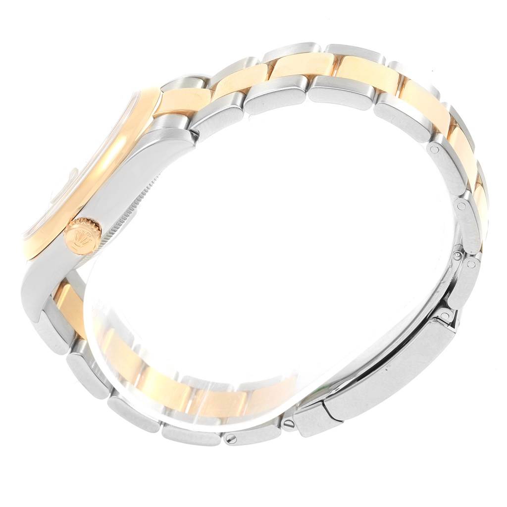 The image shows the side view of a Rolex Datejust 116203 Men's Stainless Steel Grey Dial 116203 Men's Stainless Steel Grey Dial model, highlighting the crown and two-tone bracelet.