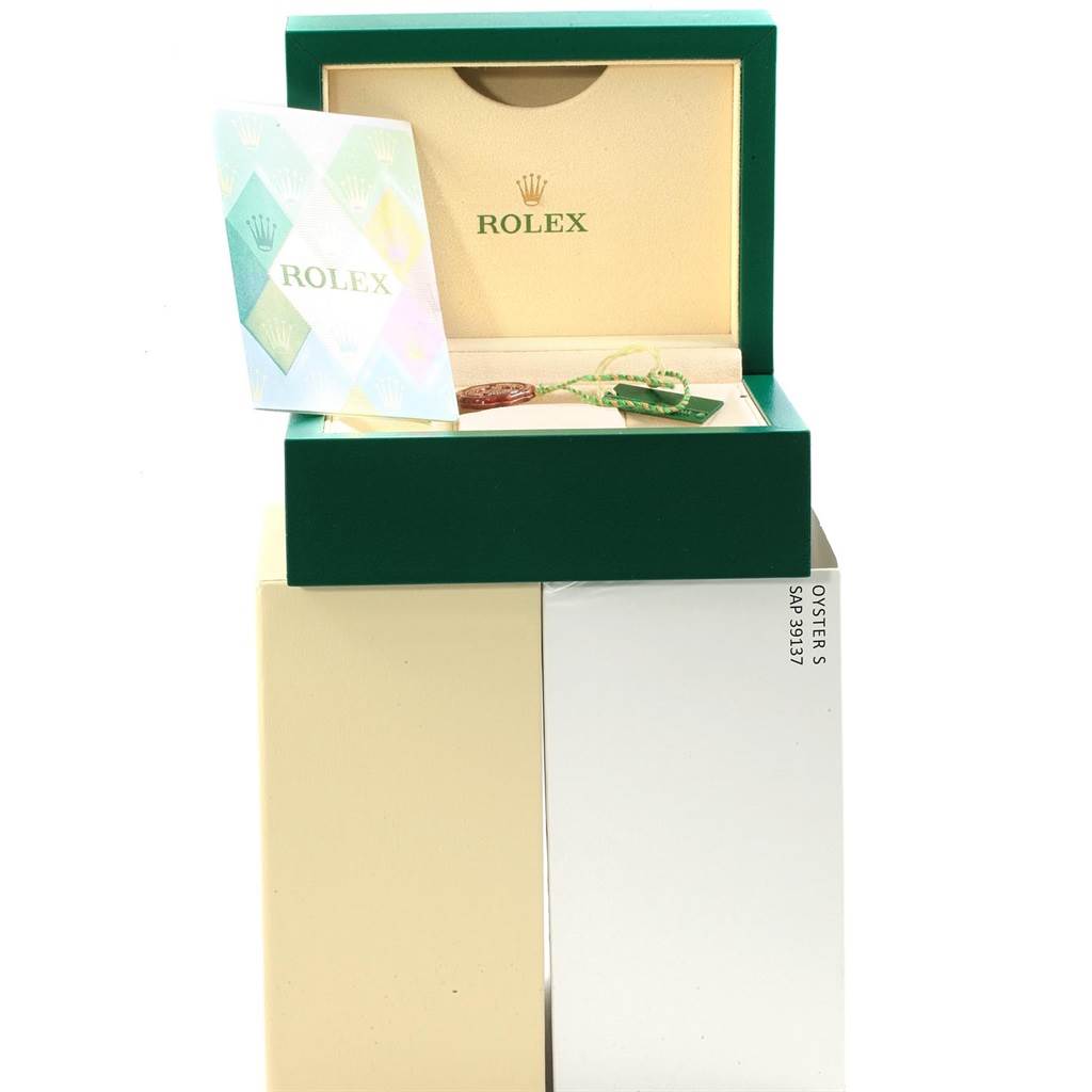 The image shows the packaging of a Rolex Datejust 116203 Men's Stainless Steel Grey Dial 116203 Men's Stainless Steel Grey Dial, including the green box, booklet, tags, and an outer cream-colored box.