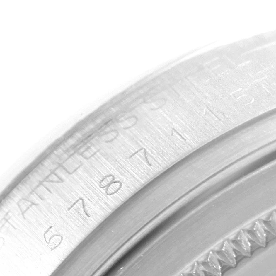 This image shows a close-up of the stainless steel case back with engraved markings on a Rolex Datejust 16014 Men's Stainless Steel Silver Dial 16014 Men's Stainless Steel Silver Dial watch.