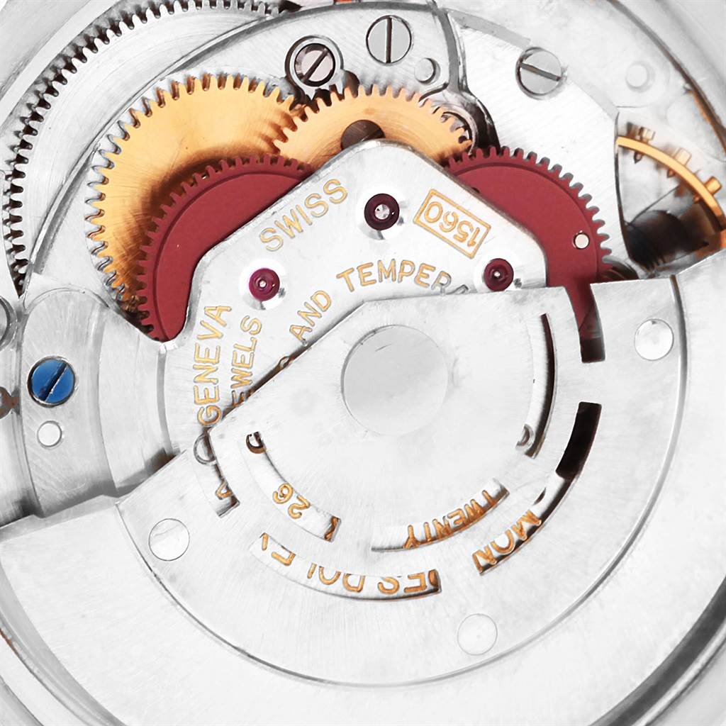This close-up image showcases the intricate internal gears and mechanics of the Rolex Vintage Collection 1601 Men's Steel and Gold (two tone) Silver Dial 1601 Men's Steel and Gold (two tone) Silver Dial watch.