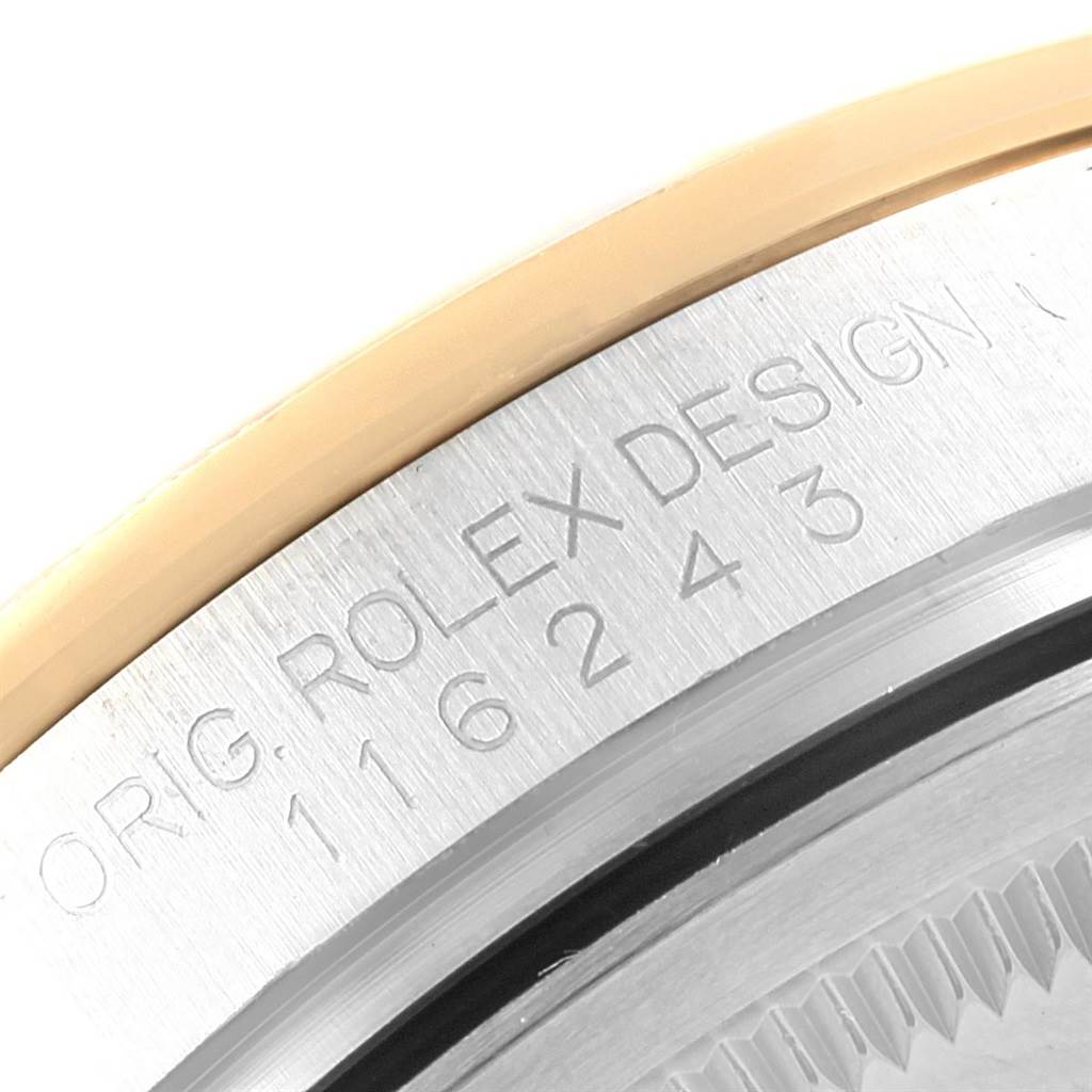 The image shows a close-up of the case engraving and part of the bezel of a Rolex Datejust 116243 Men's Stainless Steel Mother of Pearl Dial 116243 Men's Stainless Steel Mother of Pearl Dial watch.