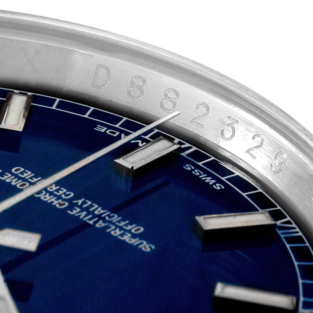 Close-up view of a blue dial and serial number edge of a Rolex Datejust 116234 Men's Stainless Steel Blue Dial 116234 Men's Stainless Steel Blue Dial watch.