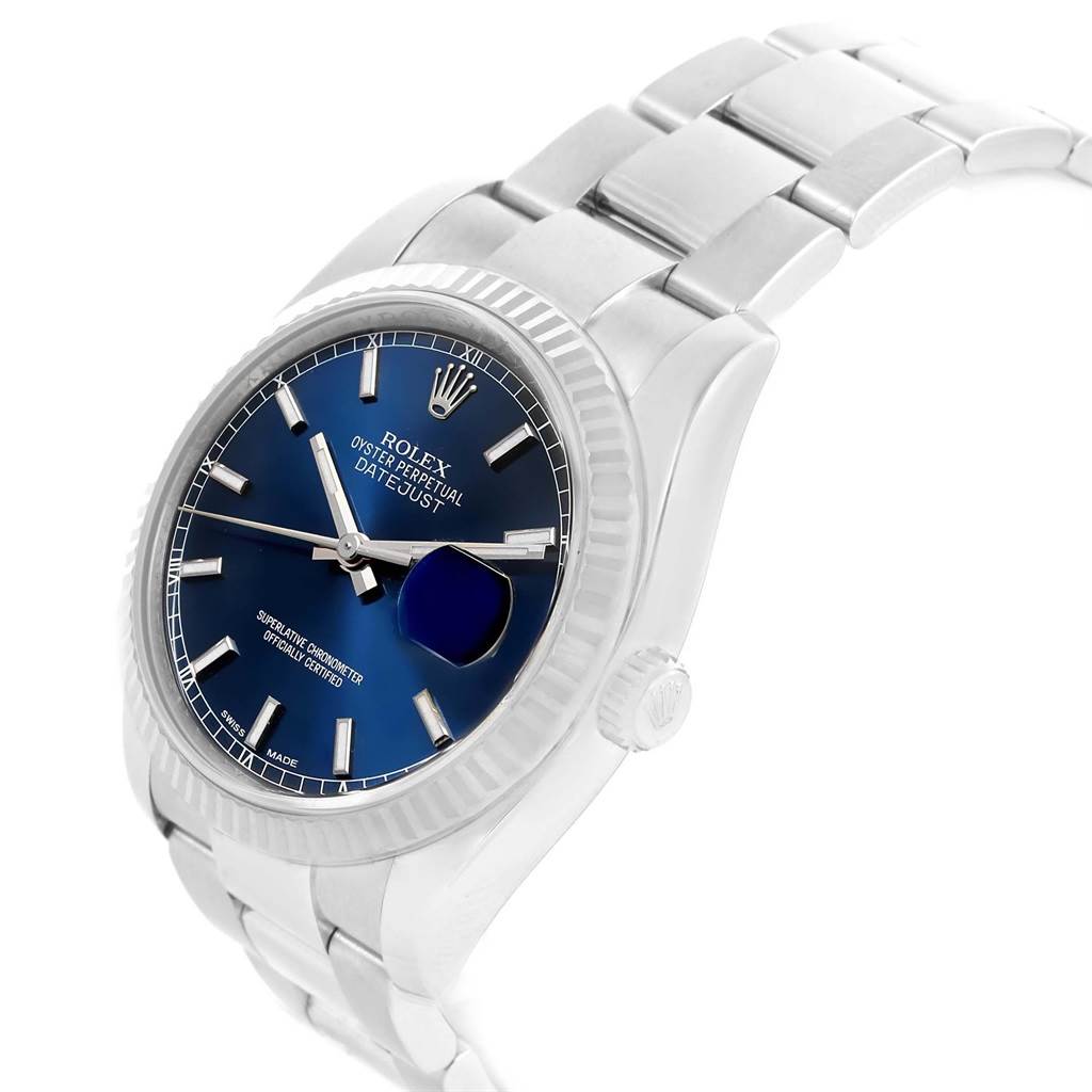 The Rolex Datejust 116234 Men's Stainless Steel Blue Dial 116234 Men's Stainless Steel Blue Dial watch is shown at an angled view, highlighting its blue dial, fluted bezel, and Oyster bracelet.