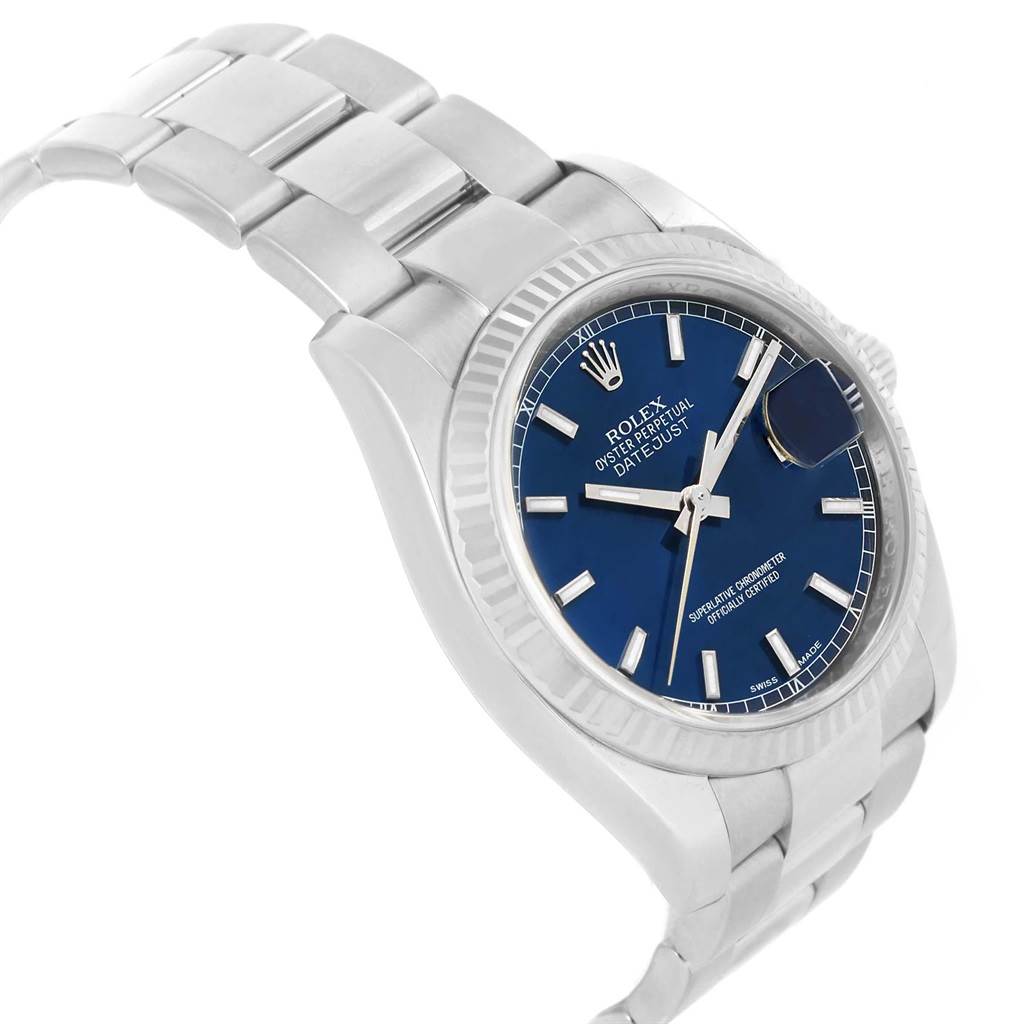 The image shows a Rolex Datejust 116234 Men's Stainless Steel Blue Dial 116234 Men's Stainless Steel Blue Dial watch at an oblique angle, highlighting the blue dial, silver bracelet, and fluted bezel.