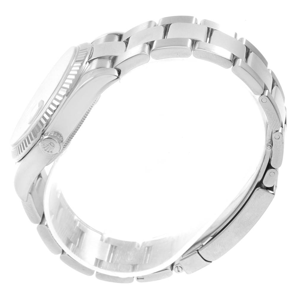 The image shows a side view of a Rolex Datejust 116234 Men's Stainless Steel Blue Dial 116234 Men's Stainless Steel Blue Dial watch, highlighting its bracelet, clasp, and crown.