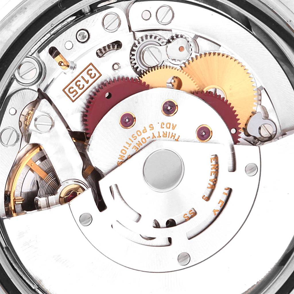 This image shows a close-up of the inner mechanical movement components of a Rolex Datejust 116139 Men's White Gold Blue Dial 116139 Men's White Gold Blue Dial watch, showcasing gears and the rotor.
