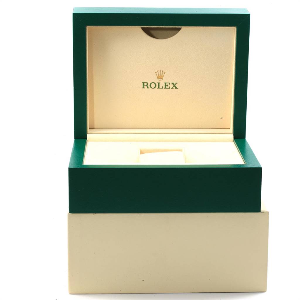 The image shows an open green and beige Rolex watch box for the Datejust model, viewed from the front.