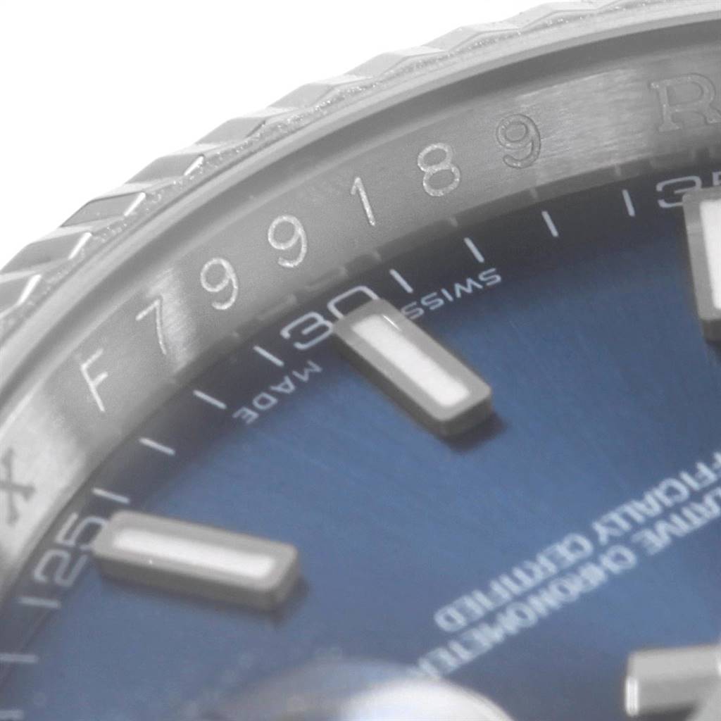 The image shows a close-up of the Rolex Datejust 116139 Men's White Gold Blue Dial 116139 Men's White Gold Blue Dial watch's blue dial, bezel, and markers, focusing on the 30-minute index.