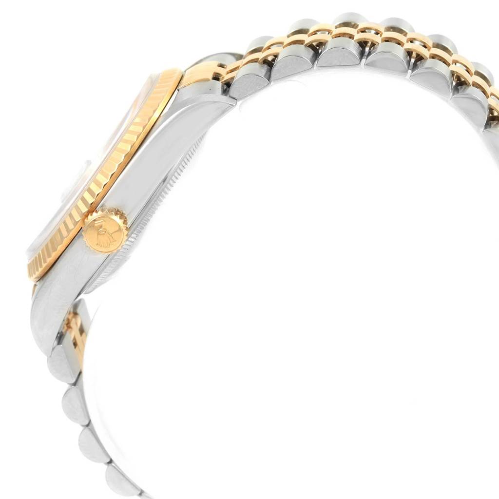 This image shows a side view of the Rolex Datejust 16233 Men
s Stainless Steel Beige Dial 16233 Men
s Stainless Steel Beige Dial, highlighting its crown, bezel, and part of the bracelet.