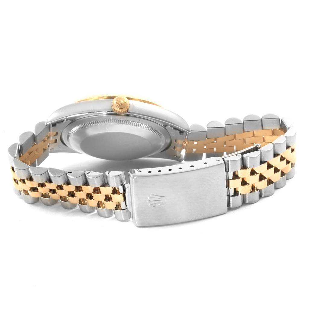 The image shows a side and back view of a Rolex Datejust 16233 Men
s Stainless Steel Beige Dial 16233 Men
s Stainless Steel Beige Dial watch, highlighting its bracelet, clasp, and crown.