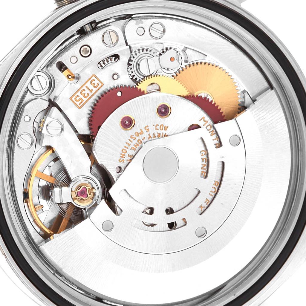 This is an internal view of the Rolex Datejust 16234 Men
s Stainless Steel Silver Dial 16234 Men
s Stainless Steel Silver Dial movement, showcasing gears and components from a top-down angle.