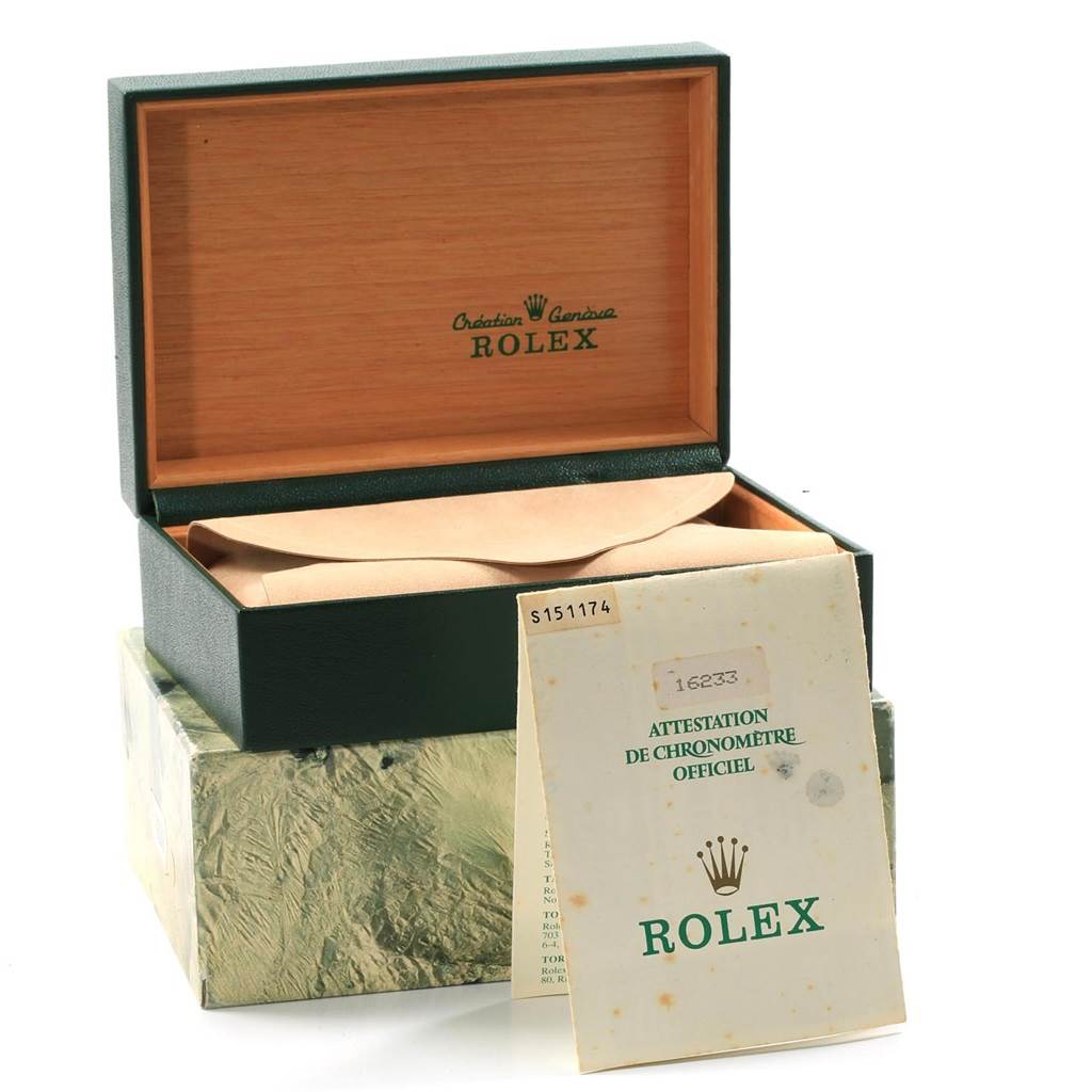 The image shows an open Rolex Datejust 16233 Men
s Steel and Gold (two tone) White Dial 16233 Men
s Steel and Gold (two tone) White Dial watch box with its original certificate and packaging.