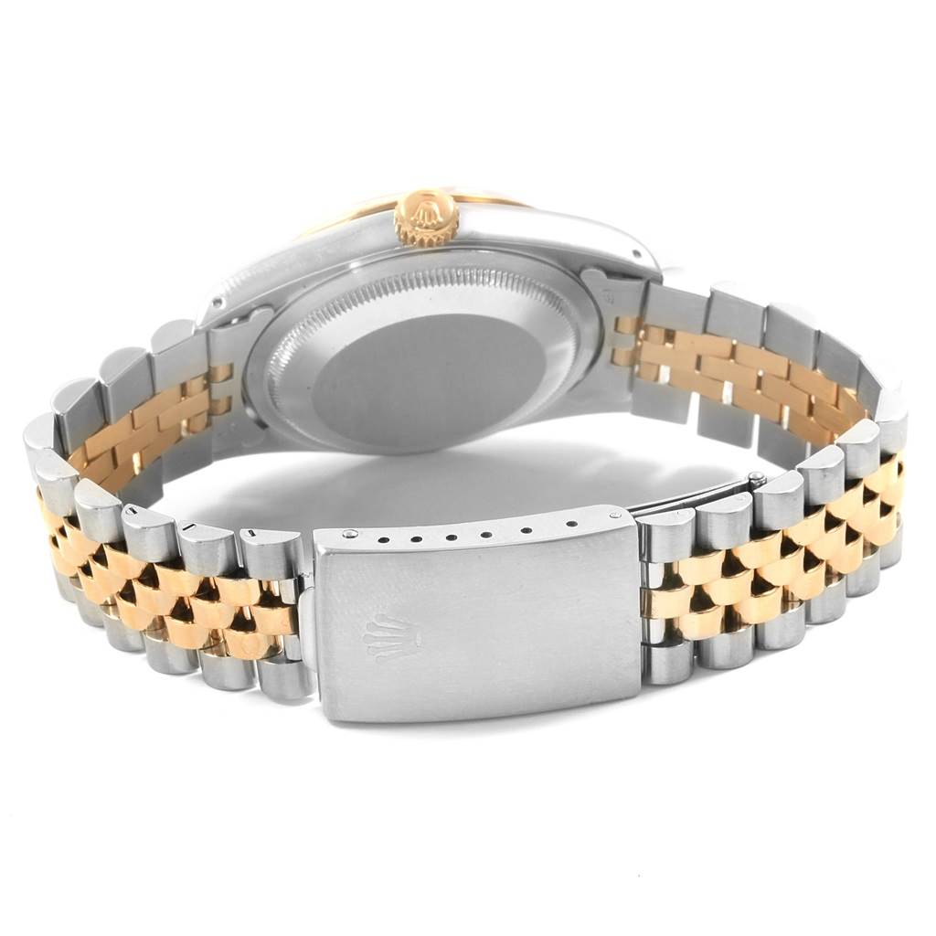 This image shows the back view of a Rolex Datejust 16233 Men
s Steel and Gold (two tone) White Dial 16233 Men
s Steel and Gold (two tone) White Dial watch, highlighting its clasp, two-tone bracelet, and case back.
