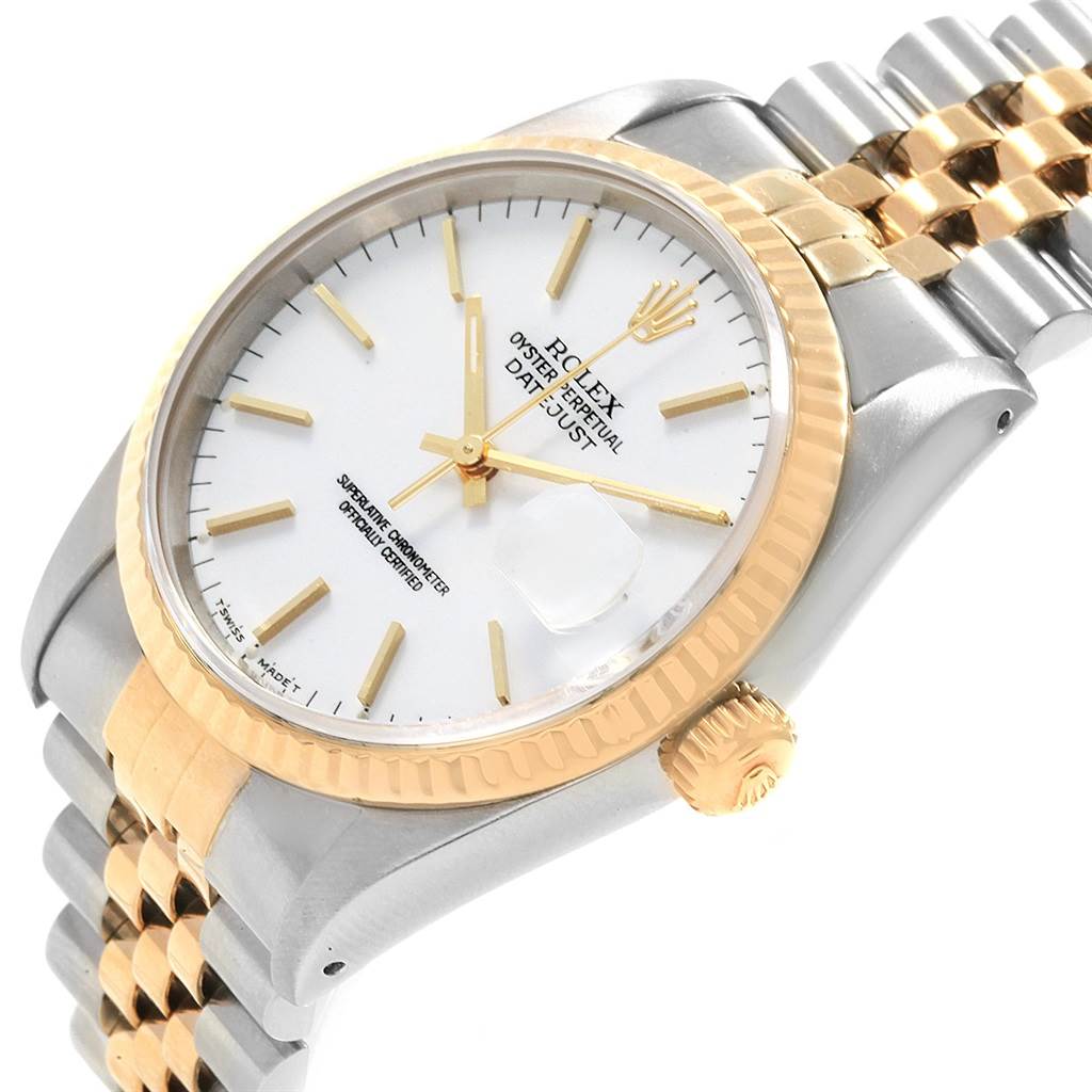 The image shows a close-up angled view of a Rolex Datejust 16233 Men
s Steel and Gold (two tone) White Dial 16233 Men
s Steel and Gold (two tone) White Dial, displaying its bezel, crown, bracelet, and part of the dial.