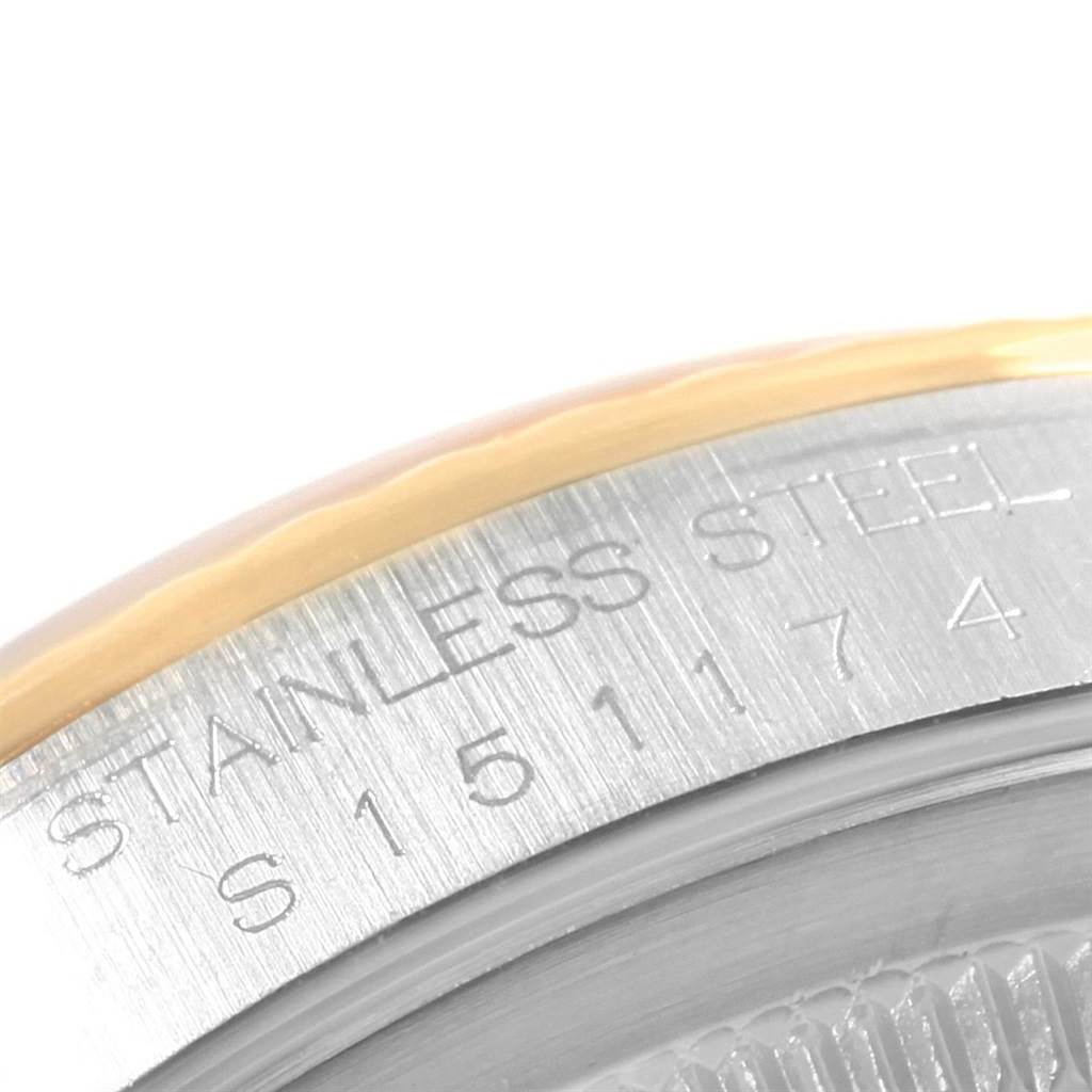 The image shows a close-up of the side engraving on a Rolex Datejust 16233 Men
s Steel and Gold (two tone) White Dial 16233 Men
s Steel and Gold (two tone) White Dial model
s stainless steel casing.