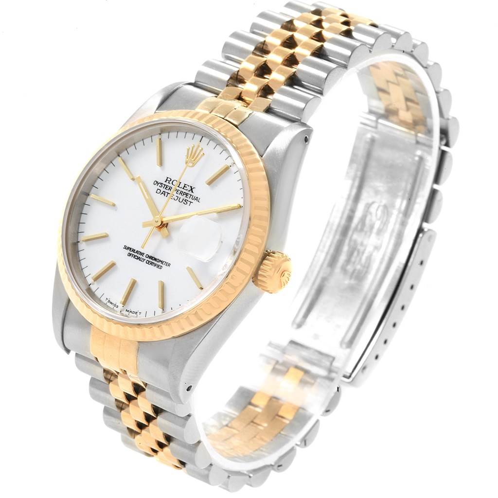 This image shows a Rolex Datejust 16233 Men
s Steel and Gold (two tone) White Dial 16233 Men
s Steel and Gold (two tone) White Dial watch at a slight angle, highlighting its dial, fluted bezel, and two-tone bracelet.