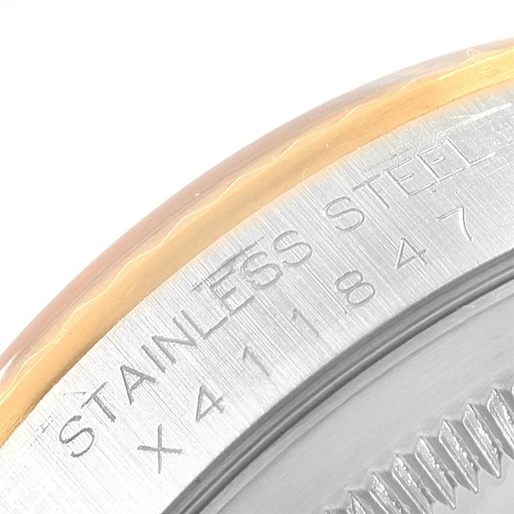 This close-up image shows the side engraving and bezel of the Rolex Datejust 16233 Men's Stainless Steel Beige Dial 16233 Men's Stainless Steel Beige Dial watch.