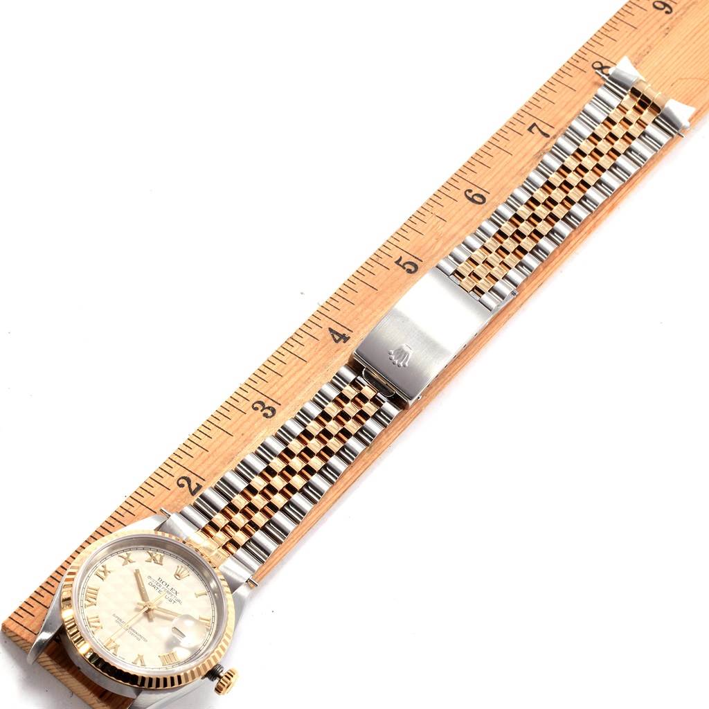 The image shows a Rolex Datejust 16233 Men's Stainless Steel Beige Dial 16233 Men's Stainless Steel Beige Dial watch face, part of the band, and a ruler for measurement, viewed from above.