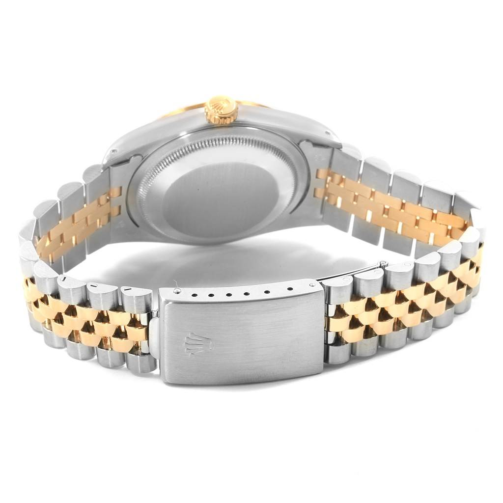 The image shows the back view of a Rolex Datejust 16233 Men's Stainless Steel Beige Dial 16233 Men's Stainless Steel Beige Dial watch, focusing on its case, crown, and two-tone bracelet and clasp.