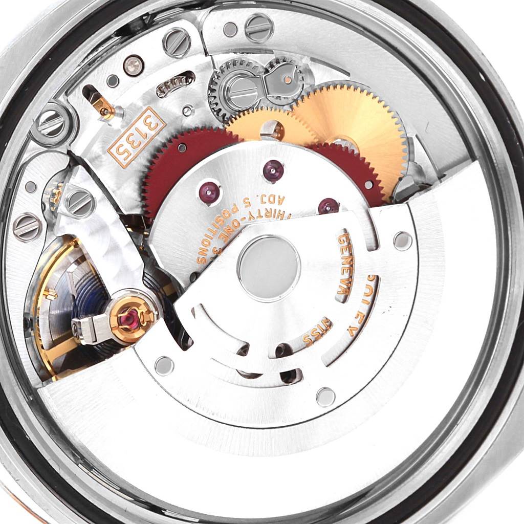 The image shows a close-up of the internal movement elements of a Rolex Datejust 116201 Men's Steel and Gold (two tone) Black Dial 116201 Men's Steel and Gold (two tone) Black Dial watch.