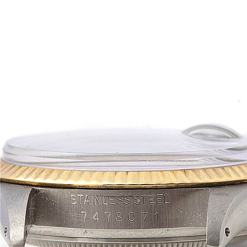 This image shows a close-up side view of a Rolex Datejust 16013 Men
s Stainless Steel Black Dial 16013 Men
s Stainless Steel Black Dial watch, focusing on the stainless steel case and serial number.