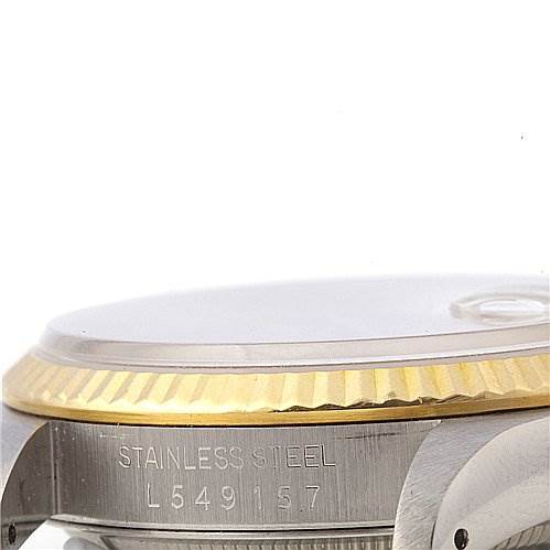 The image shows a close-up side view of a Rolex Datejust 16233 Men's Stainless Steel Champagne Dial 16233 Men's Stainless Steel Champagne Dial, highlighting the stainless steel case and the gold fluted bezel.