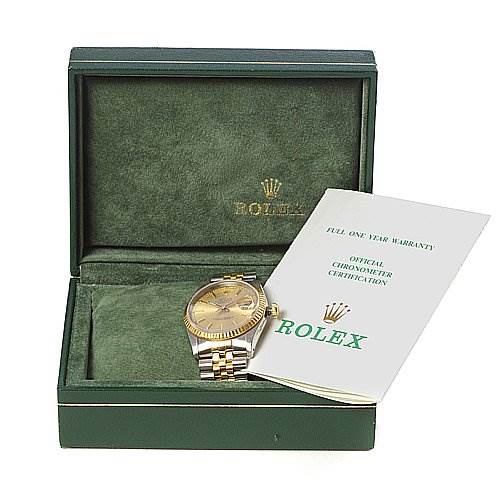 The image shows a Rolex Datejust 16233 Men's Stainless Steel Champagne Dial 16233 Men's Stainless Steel Champagne Dial watch at an angle inside its open green box, accompanied by a warranty and certification booklet.