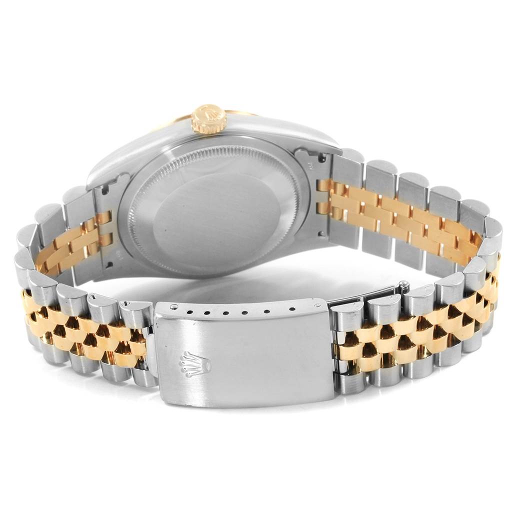 The image shows the back view of a Rolex Datejust 16233 Men's Steel and Gold (two tone) Black Dial 16233 Men's Steel and Gold (two tone) Black Dial watch, highlighting the case back and the two-tone metal bracelet with clasp.