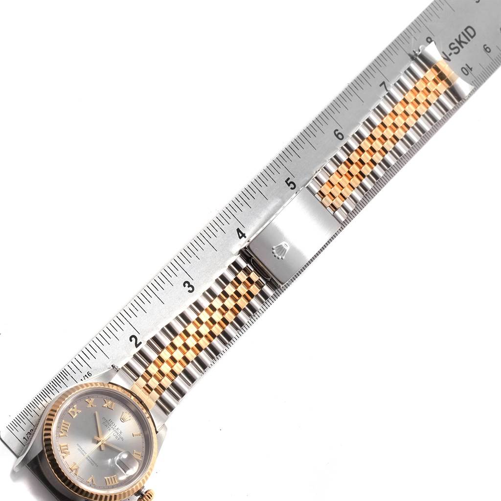 The image shows the Rolex Datejust 16233 Men's Steel and Gold (two tone) Grey Dial 16233 Men's Steel and Gold (two tone) Grey Dial watch from a top-down angle, highlighting the face and bracelet with a ruler measuring the length.