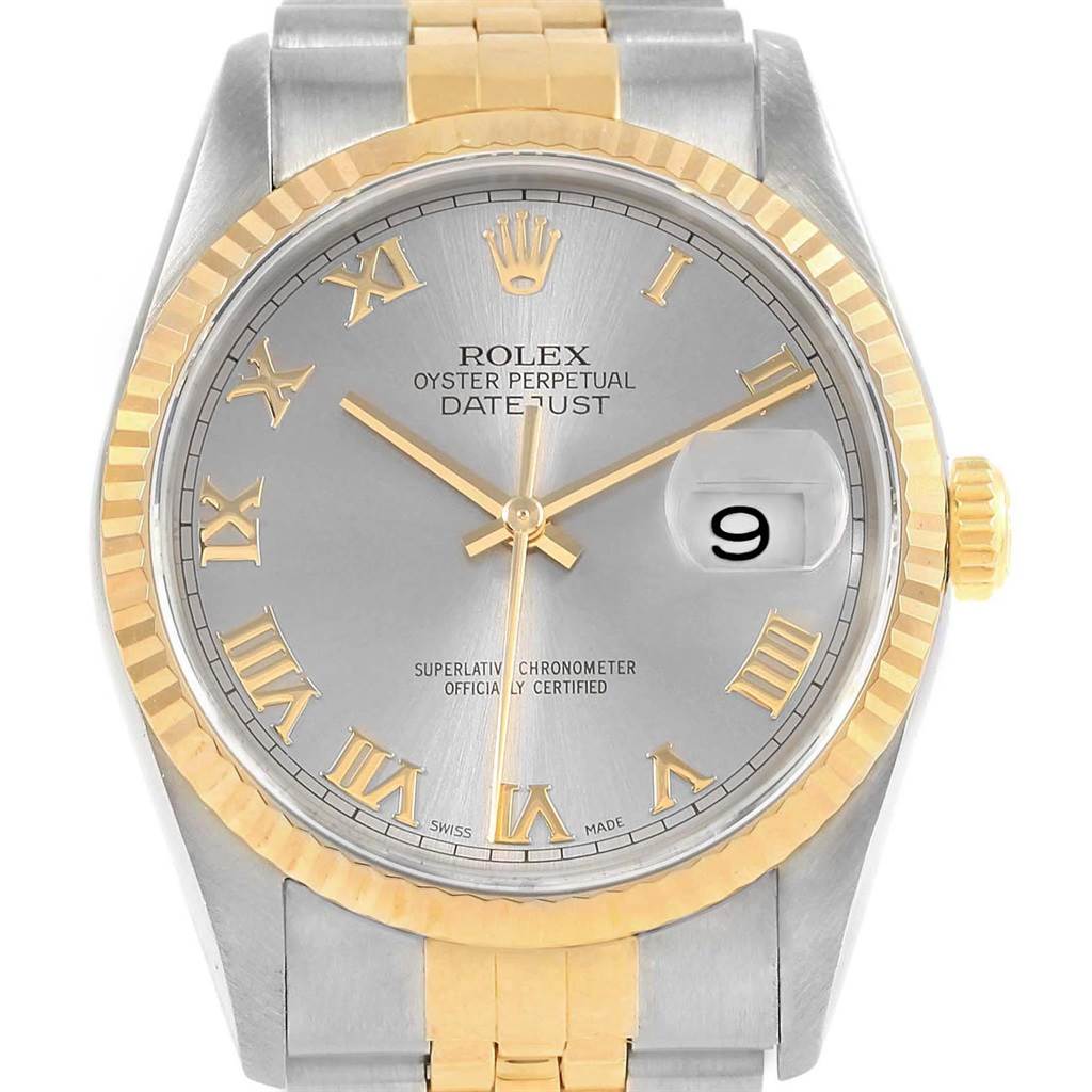 The image shows the face and partial bracelet of a Rolex Datejust 16233 Men's Steel and Gold (two tone) Grey Dial 16233 Men's Steel and Gold (two tone) Grey Dial watch, featuring a gold and silver color scheme with Roman numerals.
