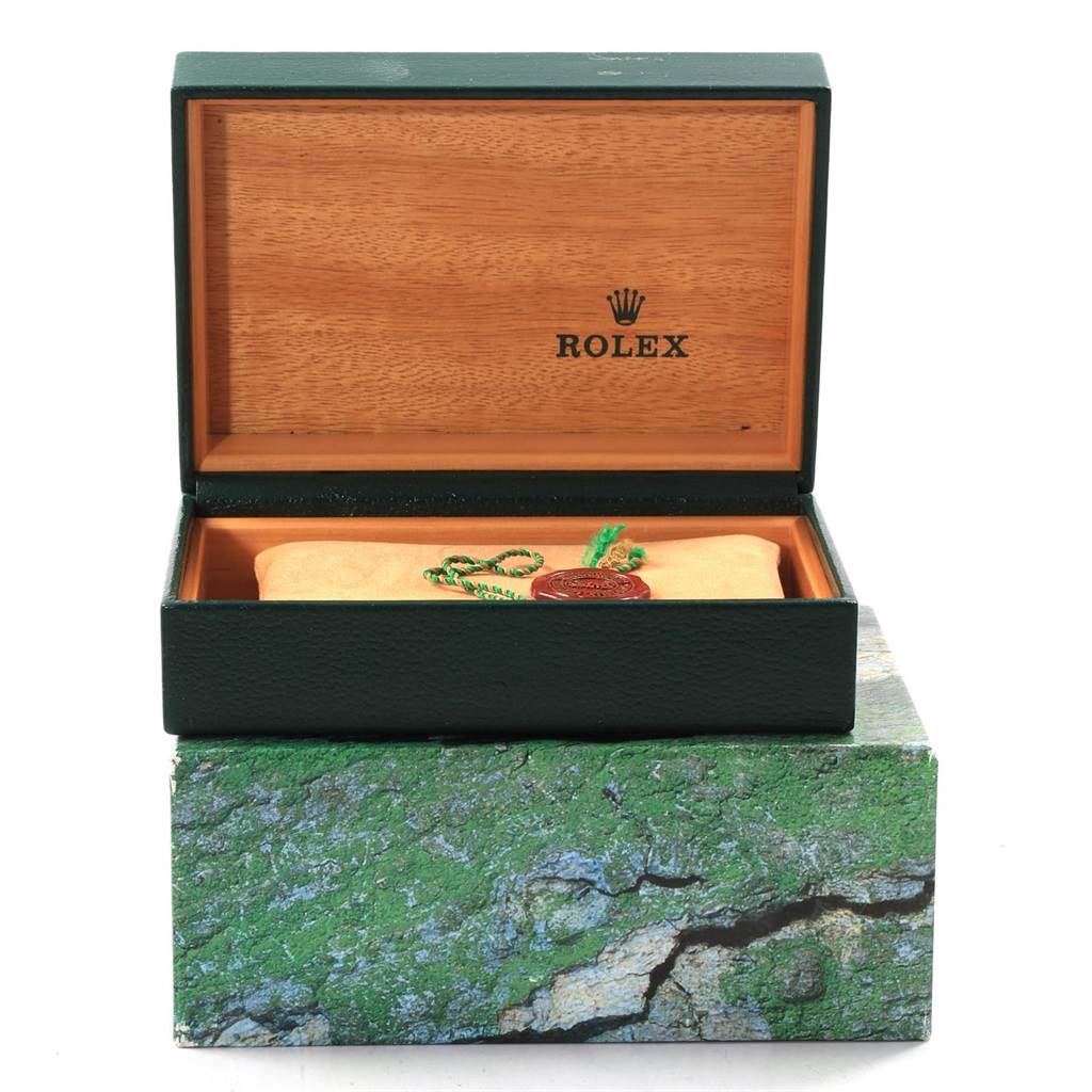 This image shows an open Rolex Datejust 16233 Men's Steel and Gold (two tone) Grey Dial 16233 Men's Steel and Gold (two tone) Grey Dial watch box with a cushion and seal inside, viewed from the front.